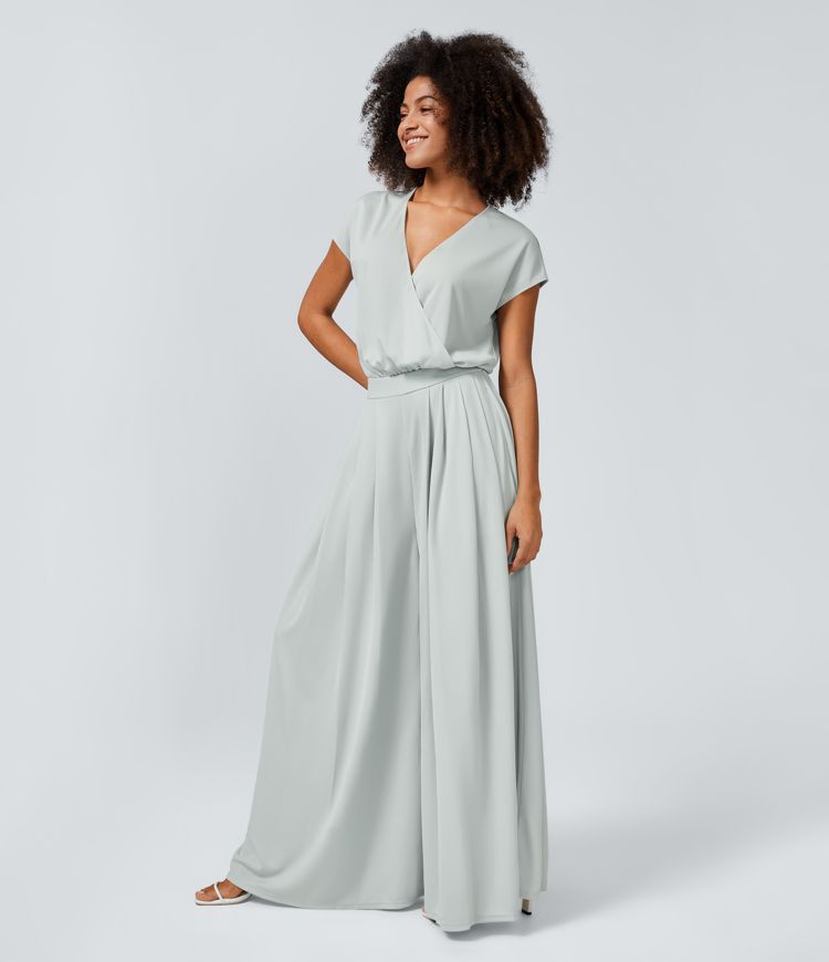 Jumpsuit™ - Tuta con scollatura a V, maniche corte, tasche laterali a pieghe e gamba larga, motivo a onde fluide.